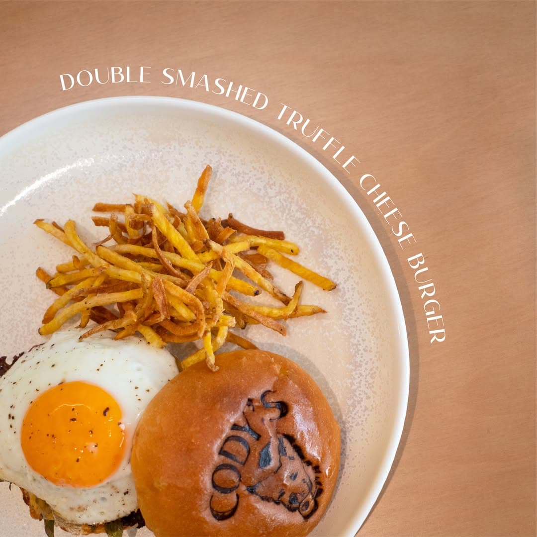 DOUBLE SMASHED TRUFFLE CHEESE BURGER
Our signature burger is layered with truffle-infused egg yolk sauce, seared beef patties melded with house-sautéed mushroom sauce for rich depth, and topped with a perfectly runny sunny-side-up egg that bursts with flavor. Served with crispy sweet potato fries—the perfect pairing.